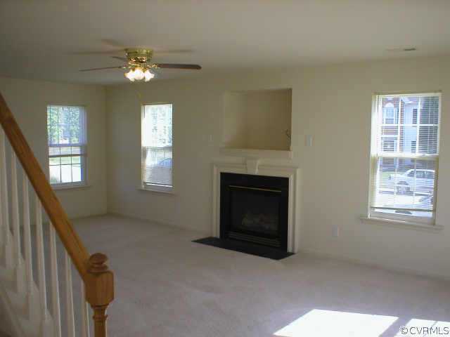 2845 Amherst Ridge Loop Colonial Heights, VA 23834 - Photo 4 of 10 a living room with furniture and a fireplace