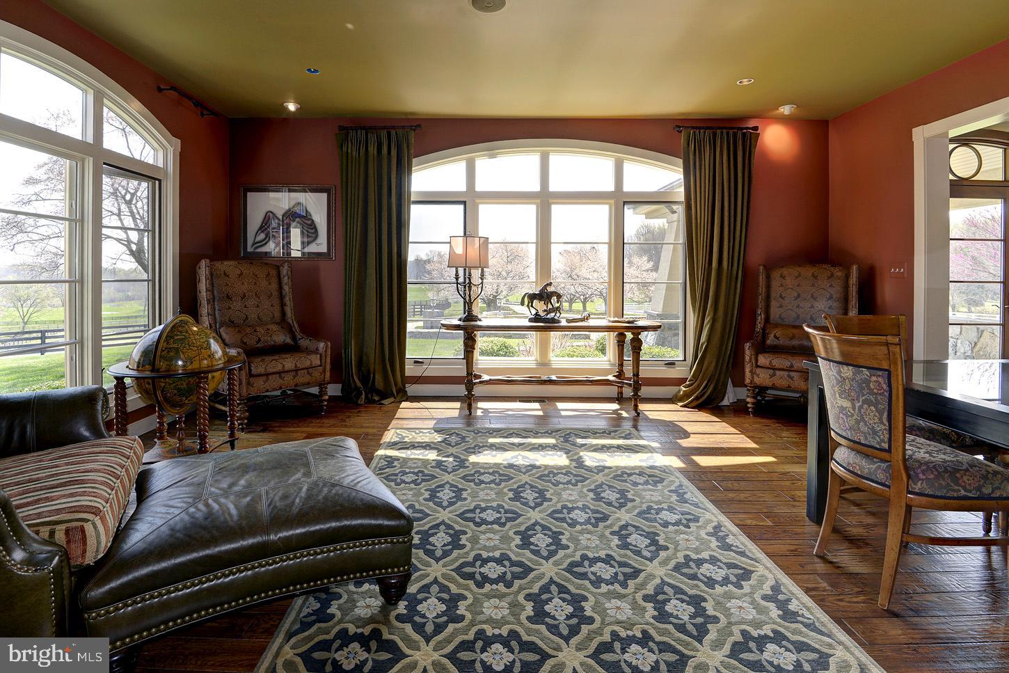 16704 Thurston Road Dickerson, MD 20842 - Photo 21 of 101 a living room with furniture hard wood floor and a floor to ceiling window