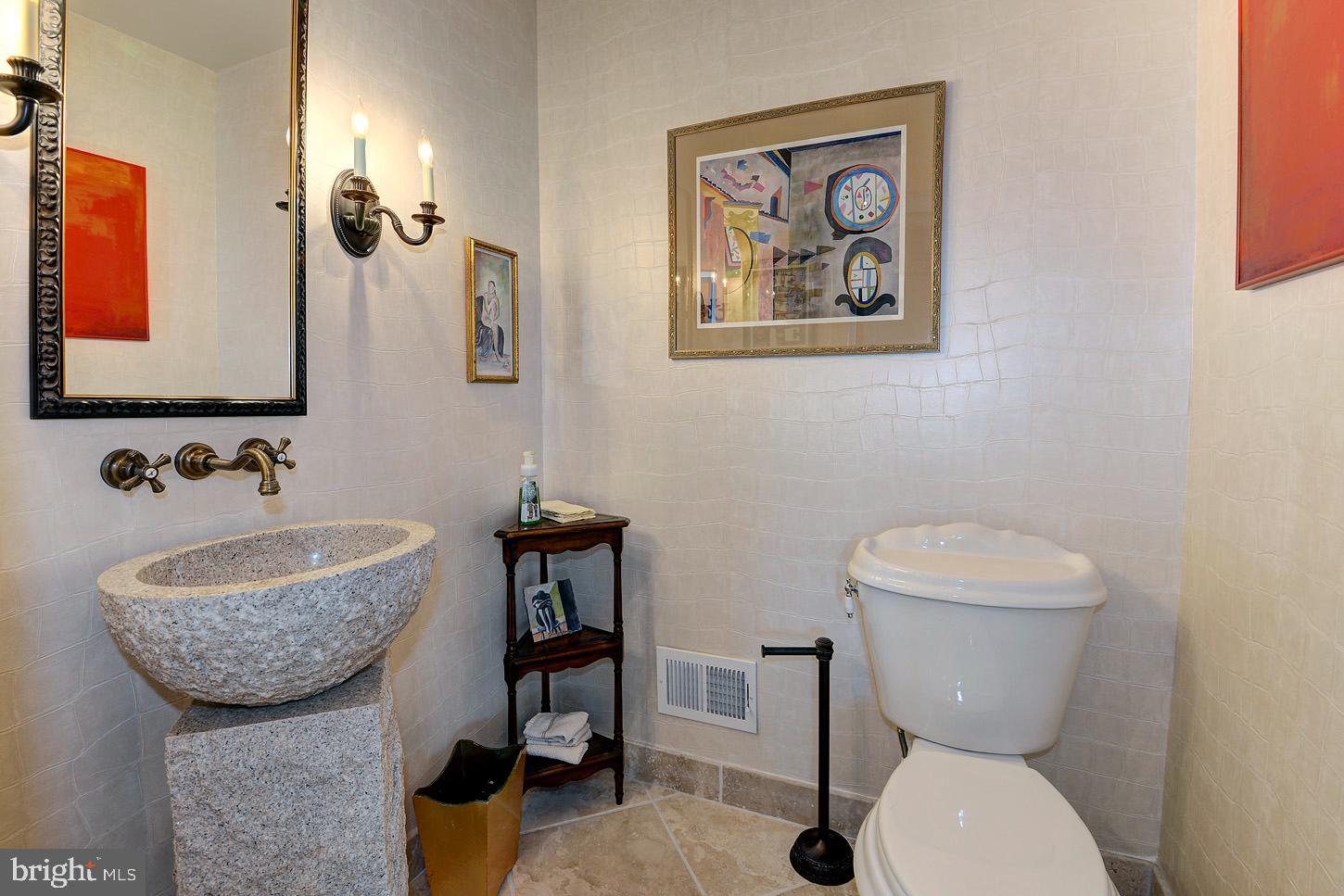 16704 Thurston Road Dickerson, MD 20842 - Photo 26 of 101 a bathroom with a toilet a sink and mirror