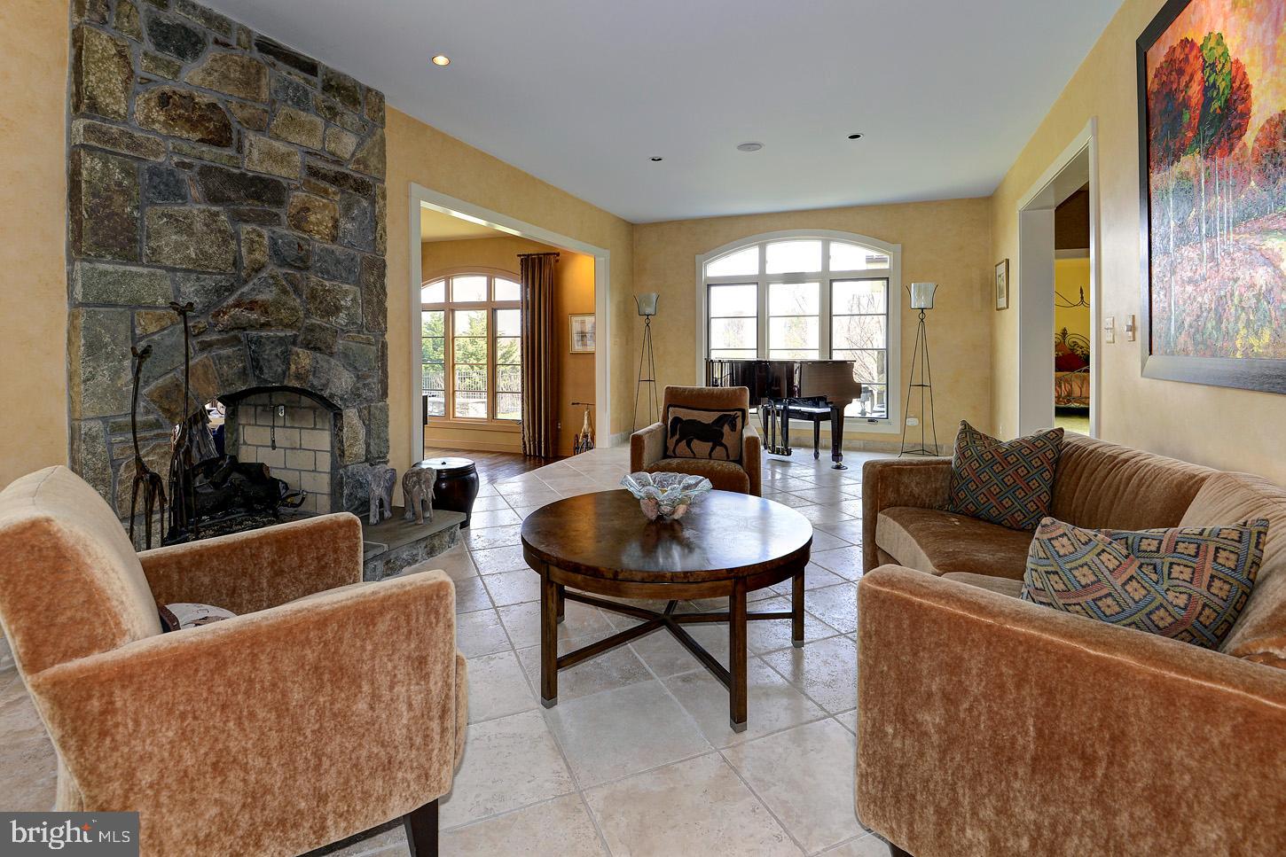 16704 Thurston Road Dickerson, MD 20842 - Photo 31 of 101 a living room with furniture and a fireplace