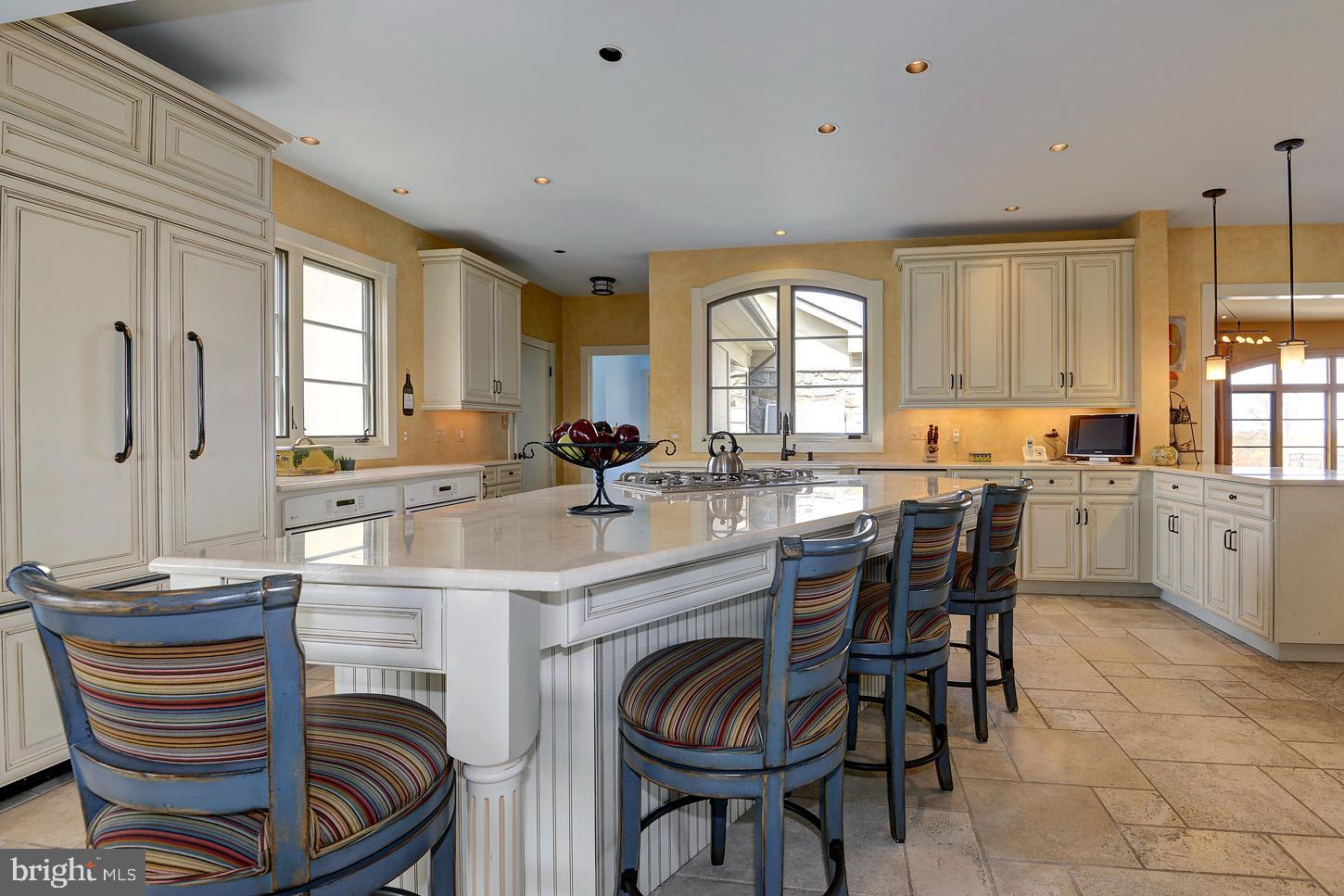 16704 Thurston Road Dickerson, MD 20842 - Photo 37 of 101 a kitchen with stainless steel appliances kitchen island granite countertop a sink and cabinets
