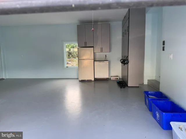 a bathroom with a sink a mirror and a window