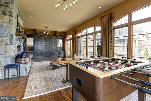 a view of a porch with furniture and a yard