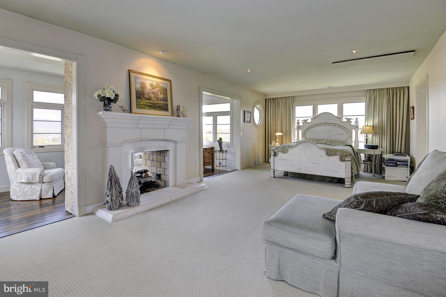 16704 Thurston Road Dickerson, MD 20842 - Photo 51 of 101 a living room with furniture and a fireplace