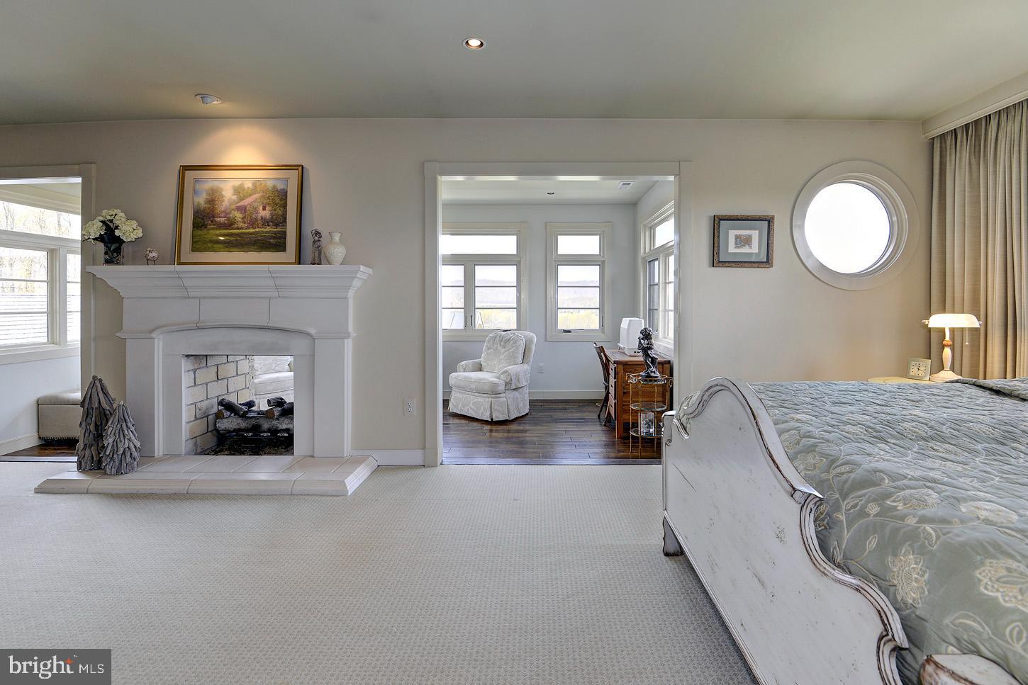 16704 Thurston Road Dickerson, MD 20842 - Photo 52 of 101 a bedroom with bed and a fireplace