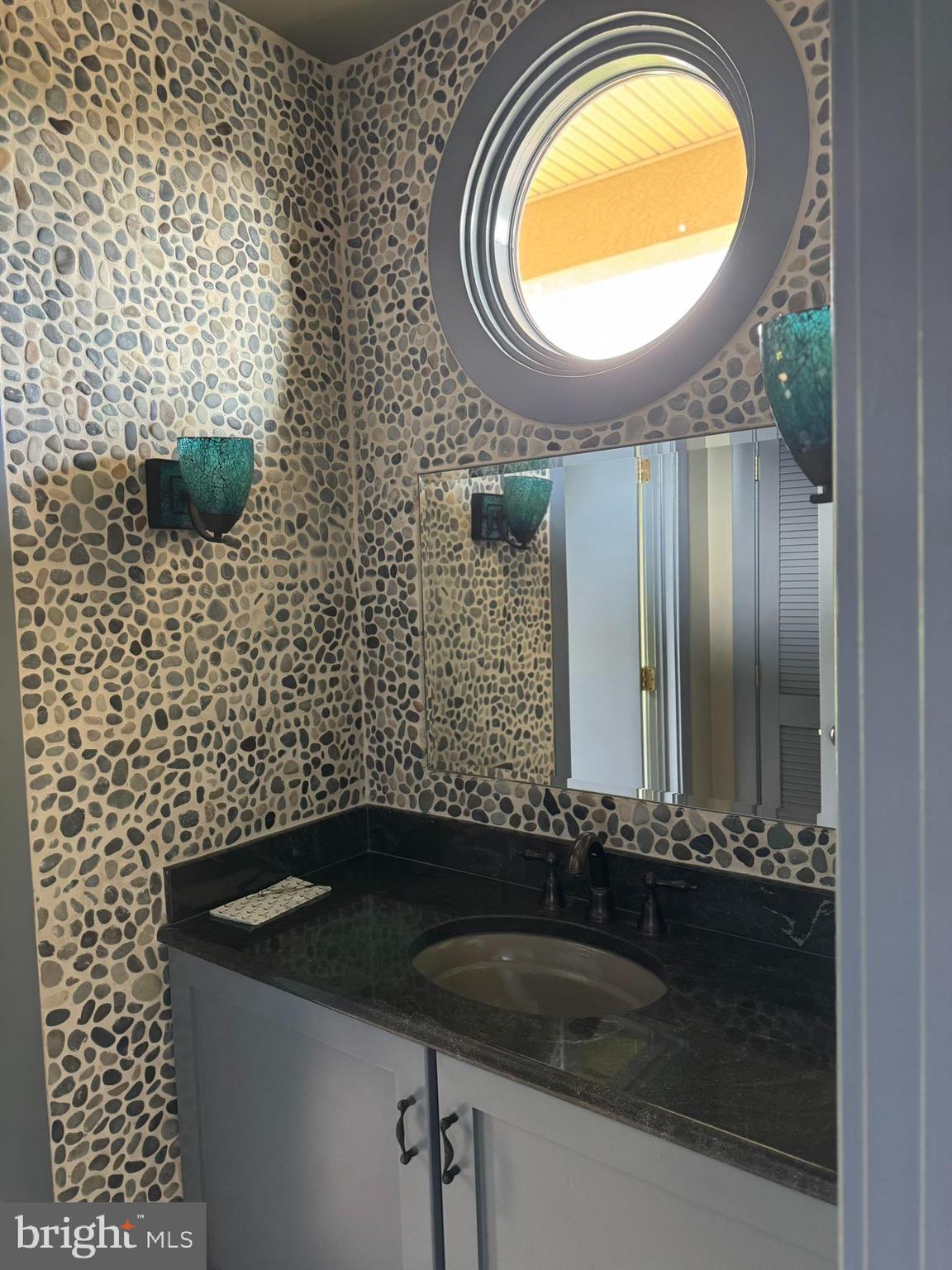 16704 Thurston Road Dickerson, MD 20842 - Photo 9 of 101 a bathroom with a sink a mirror and a window