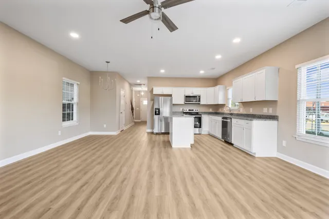 a view of kitchen with wooden floor