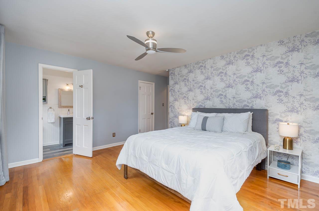 1703 Fountain Ridge Road Chapel Hill, NC 27517 - Photo 17 of 35 a bedroom with a bed and a lamp
