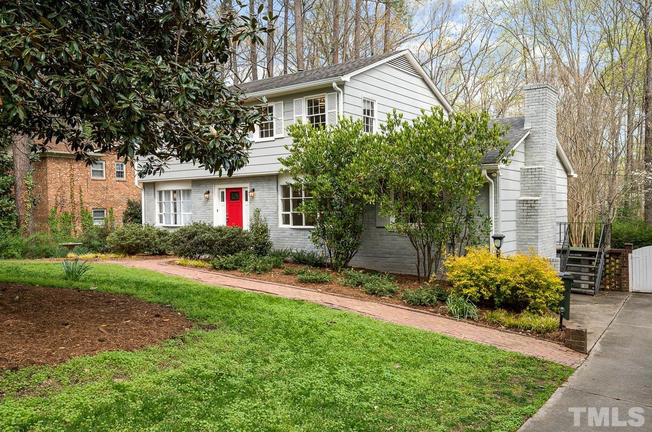 1703 Fountain Ridge Road Chapel Hill, NC 27517 - Photo 2 of 35 a front view of a house with garden