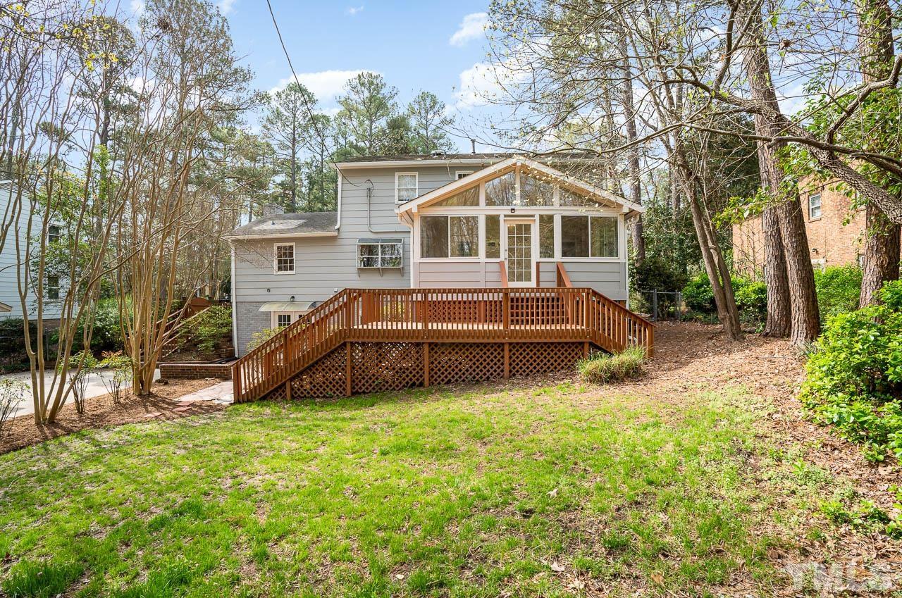 1703 Fountain Ridge Road Chapel Hill, NC 27517 - Photo 33 of 35 a house view with a garden and trees