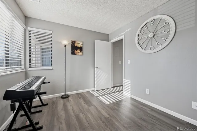 a view of a livingroom with furniture and a window