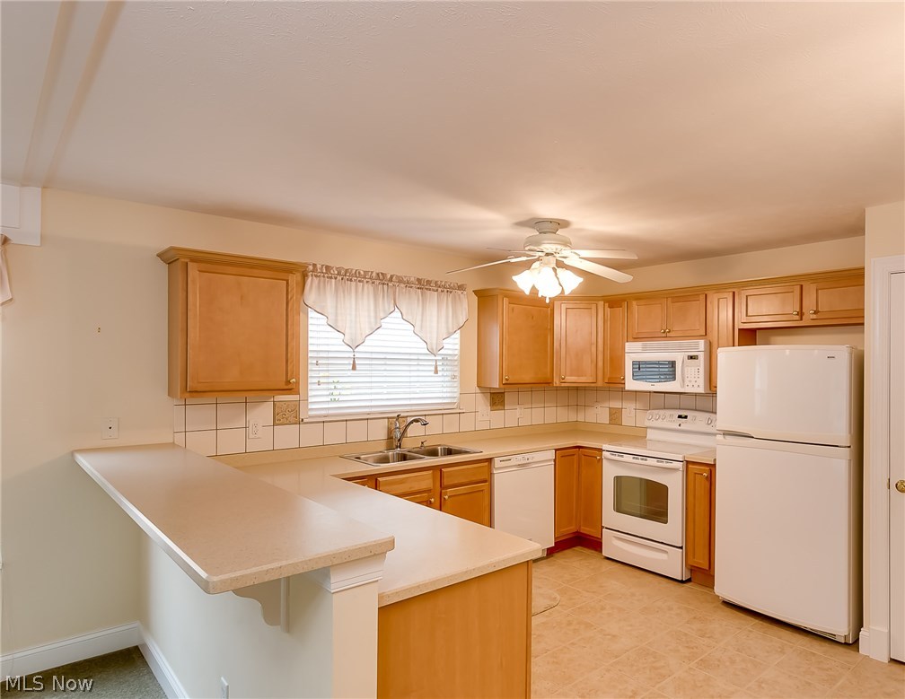 708 Rivers Edge Lane Painesville, OH 44077 - Photo 4 of 24 This kitchen is very efficient with plenty of counter space and cabinets. Pantry too! All appliances stay!