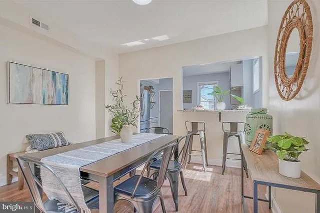 a view of a livingroom with furniture and wooden floor