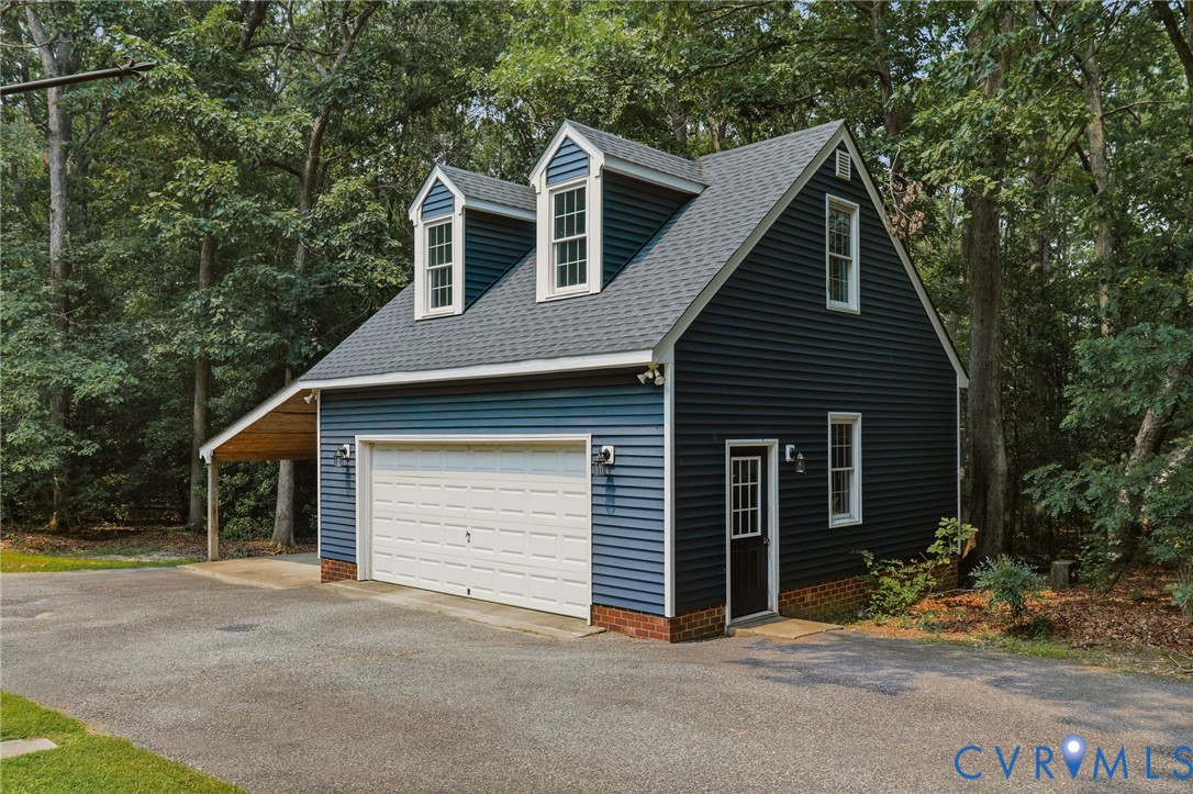 13232 Singer Road Midlothian, VA 23112 - Photo 29 of 44 Two-story, detached garage with an extra cooled ro