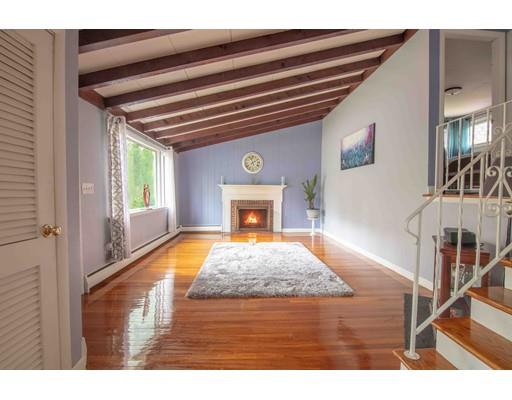 a view of hall way with furniture