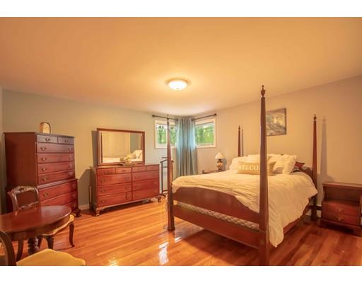 45 Preston Road Attleboro, MA 02703 - Photo 14 of 28 a bedroom with a bed and wooden floor