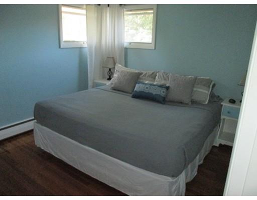 45 Preston Road Attleboro, MA 02703 - Photo 19 of 28 a bed sitting in a bedroom next to a window