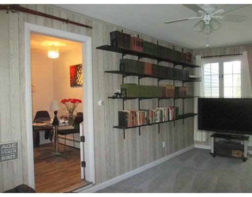 45 Preston Road Attleboro, MA 02703 - Photo 22 of 28 a living room with furniture and a flat screen tv