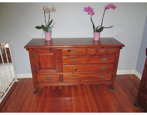 45 Preston Road Attleboro, MA 02703 - Photo 24 of 28 a room with a potted plant on a table and chair