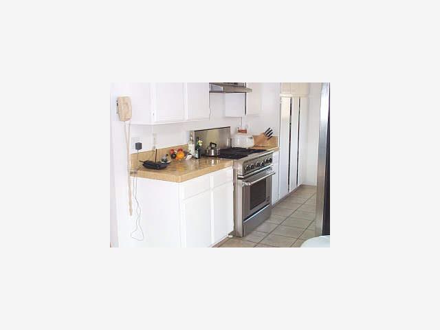 1 Berkeley Court Santa Cruz, CA 95062 - Photo 4 of 6 a kitchen with stainless steel appliances granite countertop a sink stove and refrigerator