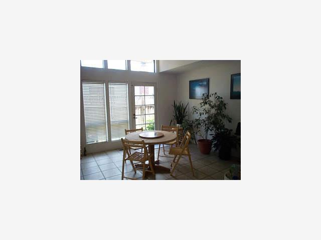 1 Berkeley Court Santa Cruz, CA 95062 - Photo 6 of 6 a living room with furniture and a potted plant