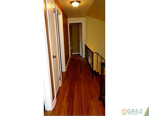786 Old Raritan Road Edison, NJ 08820 - Photo 13 of 17 a view of a hallway with wooden floor