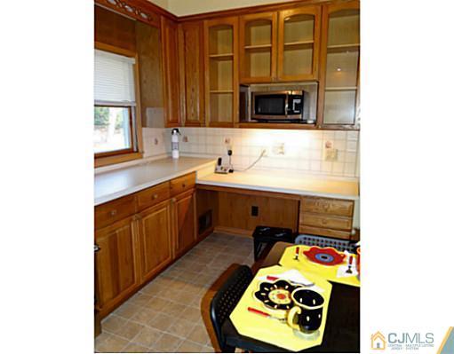 786 Old Raritan Road Edison, NJ 08820 - Photo 7 of 17 a utility room with sink dryer and washer