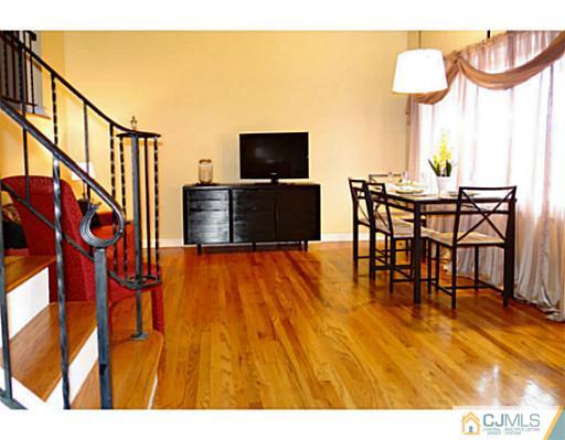786 Old Raritan Road Edison, NJ 08820 - Photo 8 of 17 a view of a dining room with furniture and wooden floor