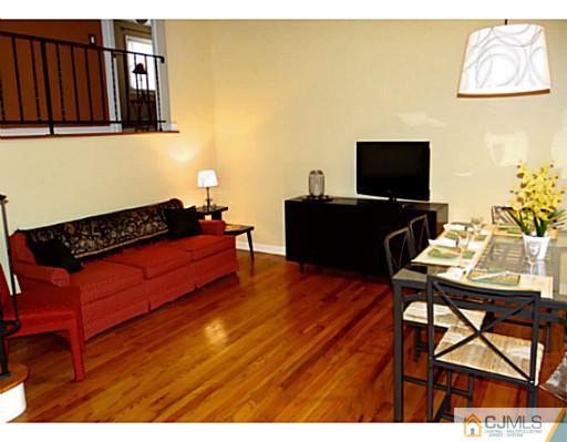 786 Old Raritan Road Edison, NJ 08820 - Photo 9 of 17 a living room with furniture and a flat screen tv