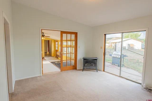 a view of an empty room with a bathroom