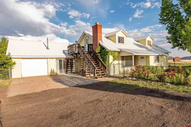 a front view of a house with a yard and outdoor space