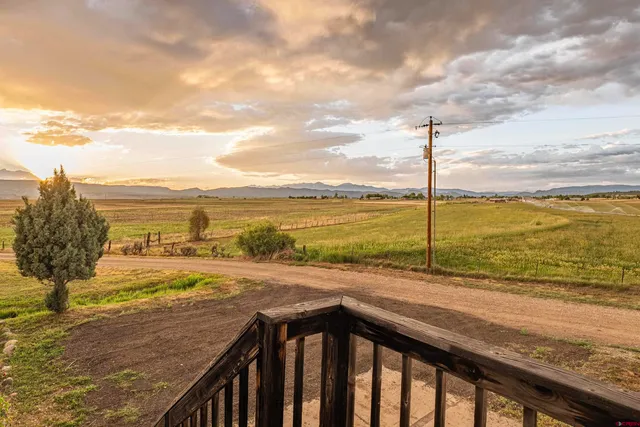 a view of a water fountain and an outdoor seating