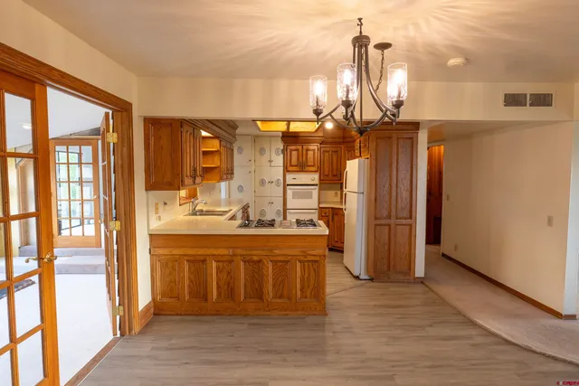 a view of a kitchen and an entryway