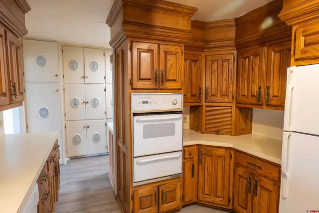 a kitchen with stainless steel appliances a refrigerator and cabinets