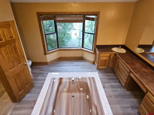 a kitchen with sink stove and cabinets