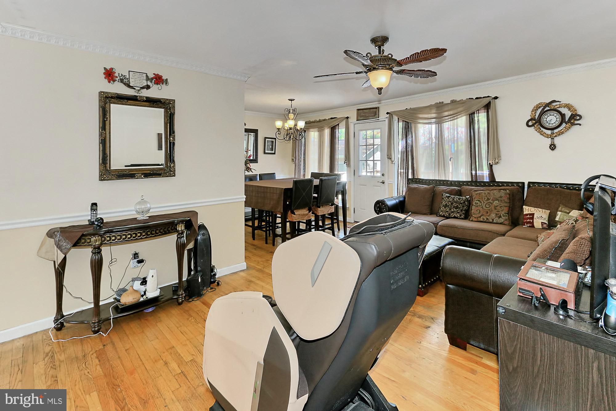 6317 Greeley Boulevard Springfield, VA 22152 - Photo 8 of 49 Lighted ceiling fan in the living room