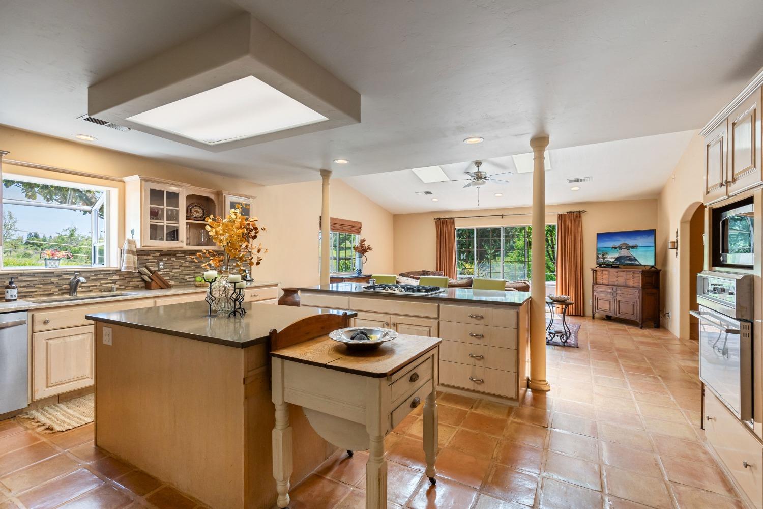 13587 Garden Bar Road Grass Valley, CA 95949 - Photo 11 of 70 a kitchen with a sink stove and cabinets
