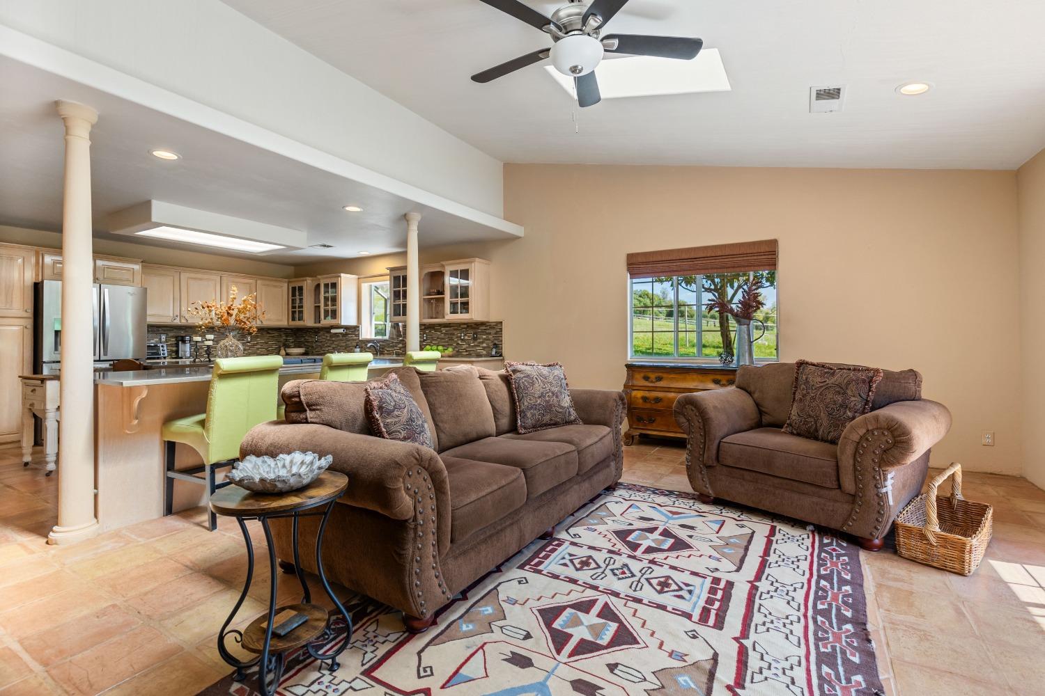 13587 Garden Bar Road Grass Valley, CA 95949 - Photo 12 of 70 a living room with furniture and a view of kitchen