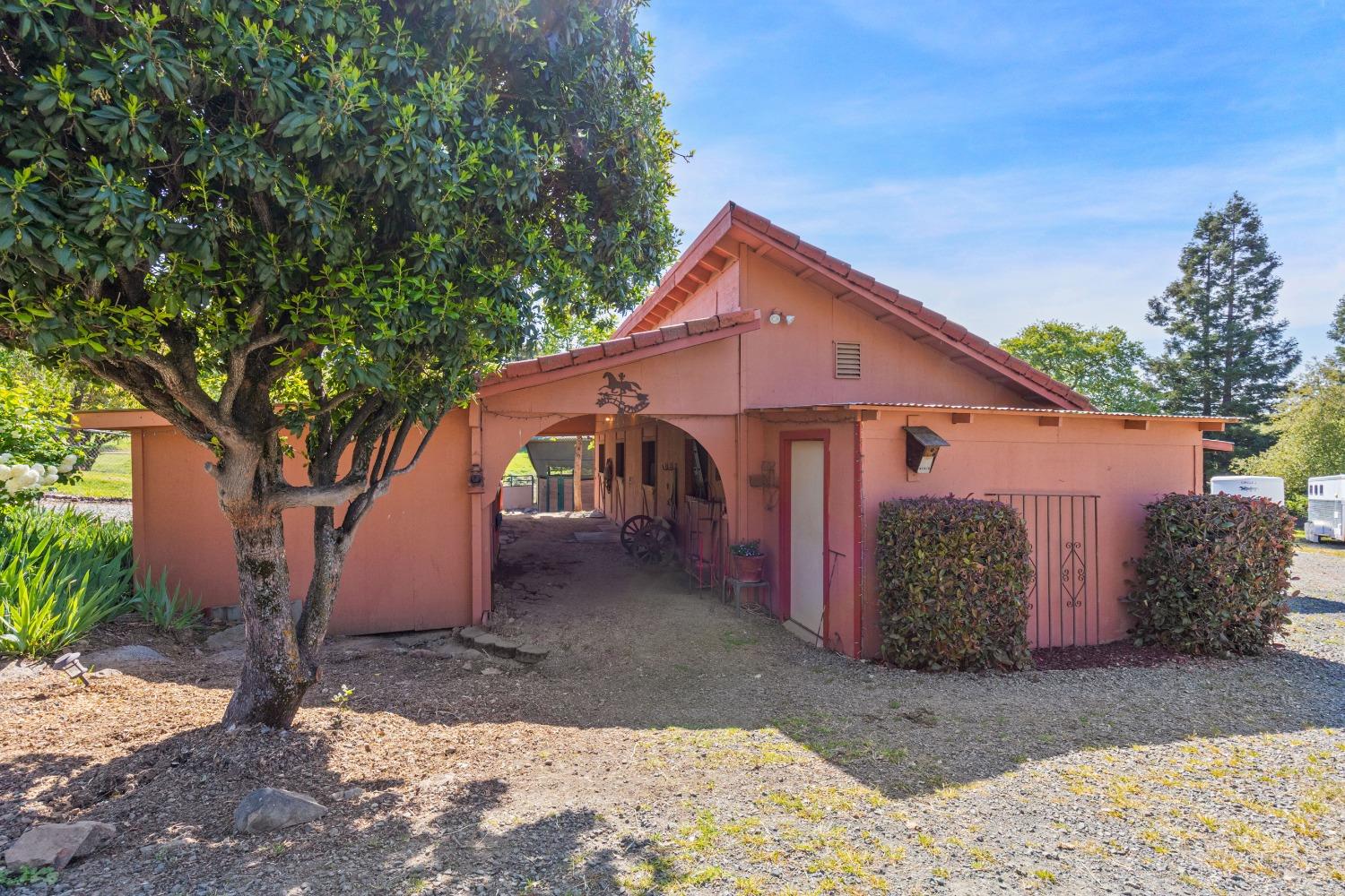 13587 Garden Bar Road Grass Valley, CA 95949 - Photo 16 of 70 a front view of a house with garden