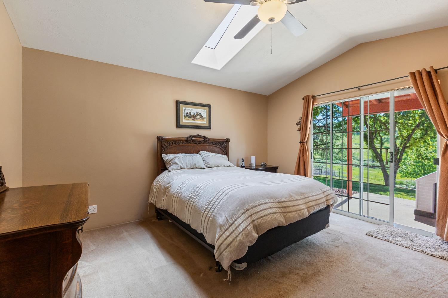 13587 Garden Bar Road Grass Valley, CA 95949 - Photo 25 of 70 a bed sitting in a spacious bedroom next to a window