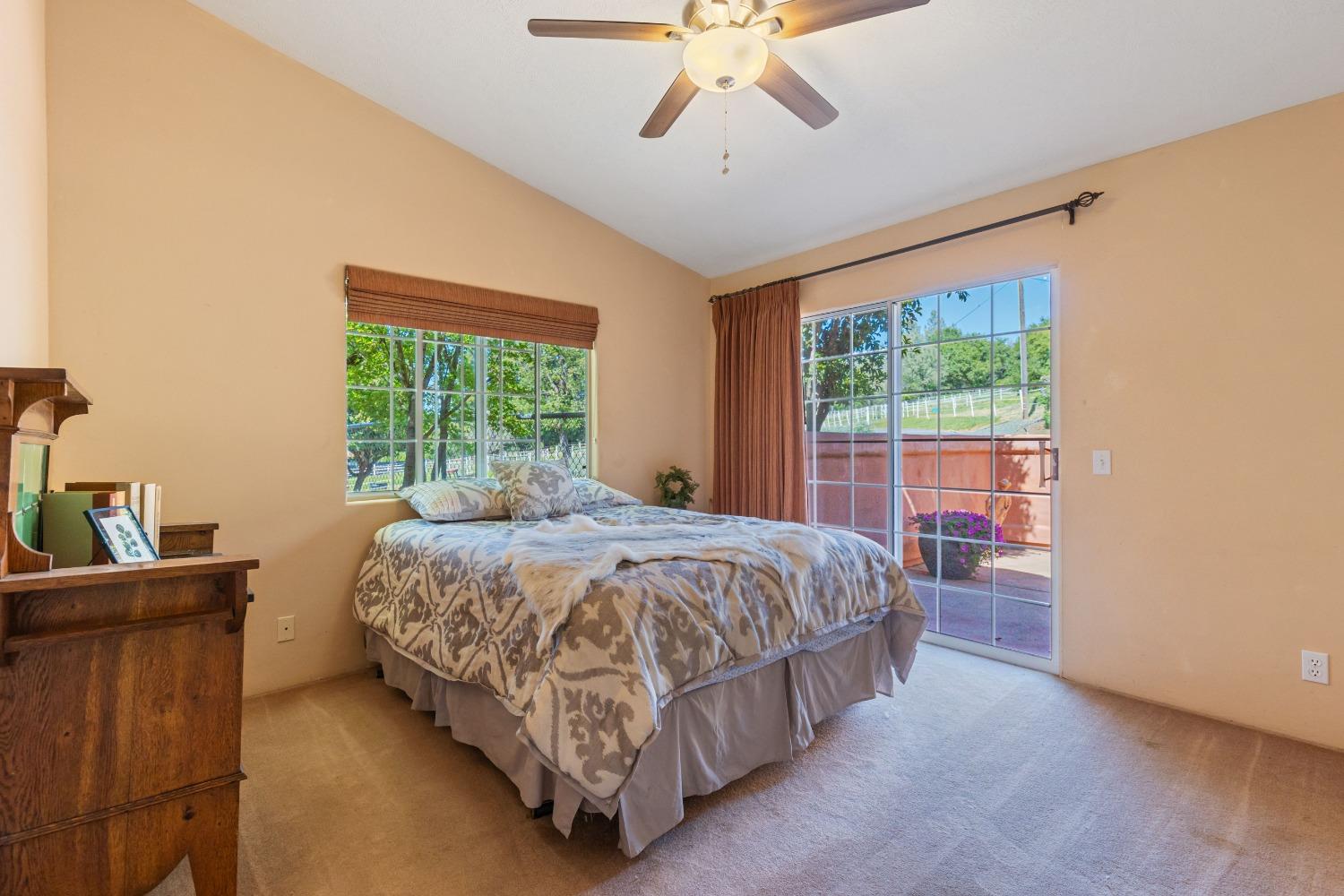 13587 Garden Bar Road Grass Valley, CA 95949 - Photo 27 of 70 a bed sitting in a bedroom next to a window
