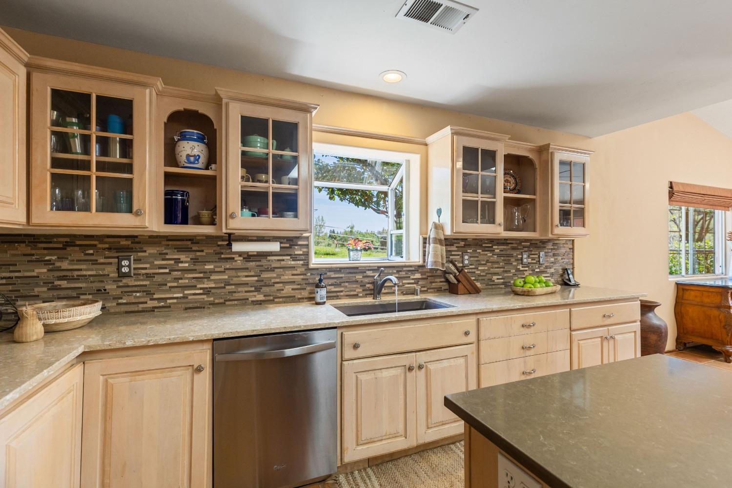 13587 Garden Bar Road Grass Valley, CA 95949 - Photo 9 of 70 a kitchen with granite countertop sink stove and cabinets
