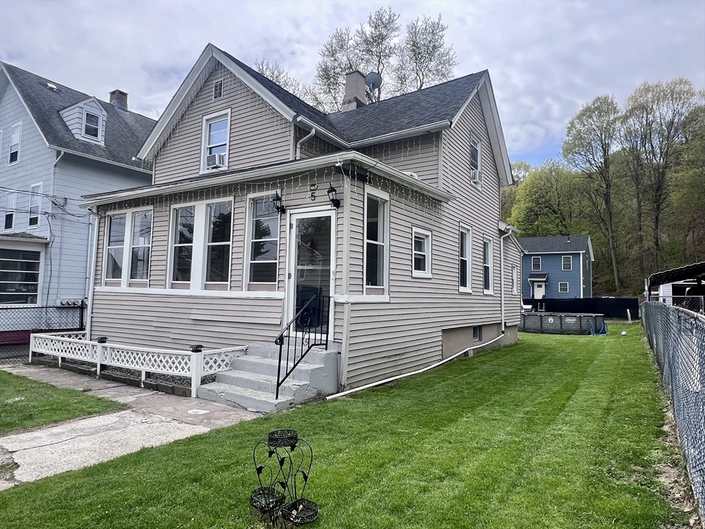 a front view of a house with a yard