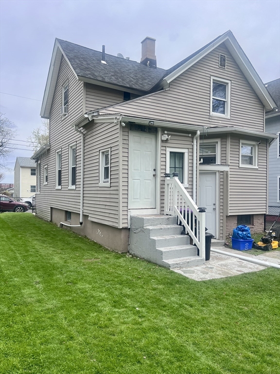 5 Vernon Street Holyoke, MA 01040 - Photo 2 of 12 a front view of a house with a garden