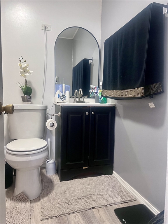 5 Vernon Street Holyoke, MA 01040 - Photo 7 of 12 a bathroom with a toilet sink and mirror