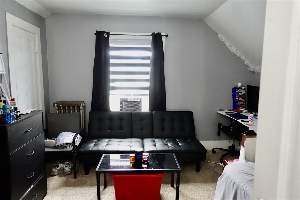 5 Vernon Street Holyoke, MA 01040 - Photo 9 of 12 a living room with furniture and a window