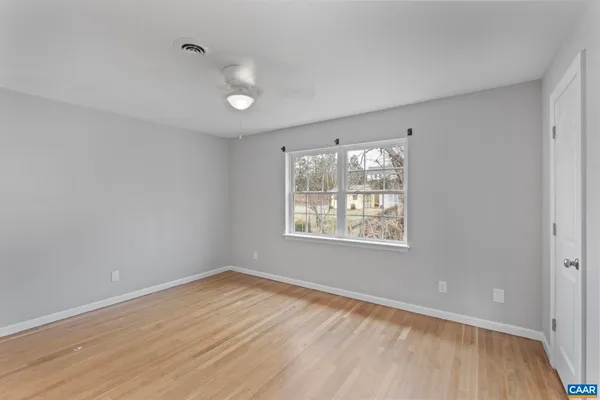 a view of a yard with snow on the road