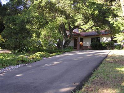 6600 Warehill Road Santa Rosa, CA 95404 - Photo 2 of 6 a front view of a house with a yard and garage