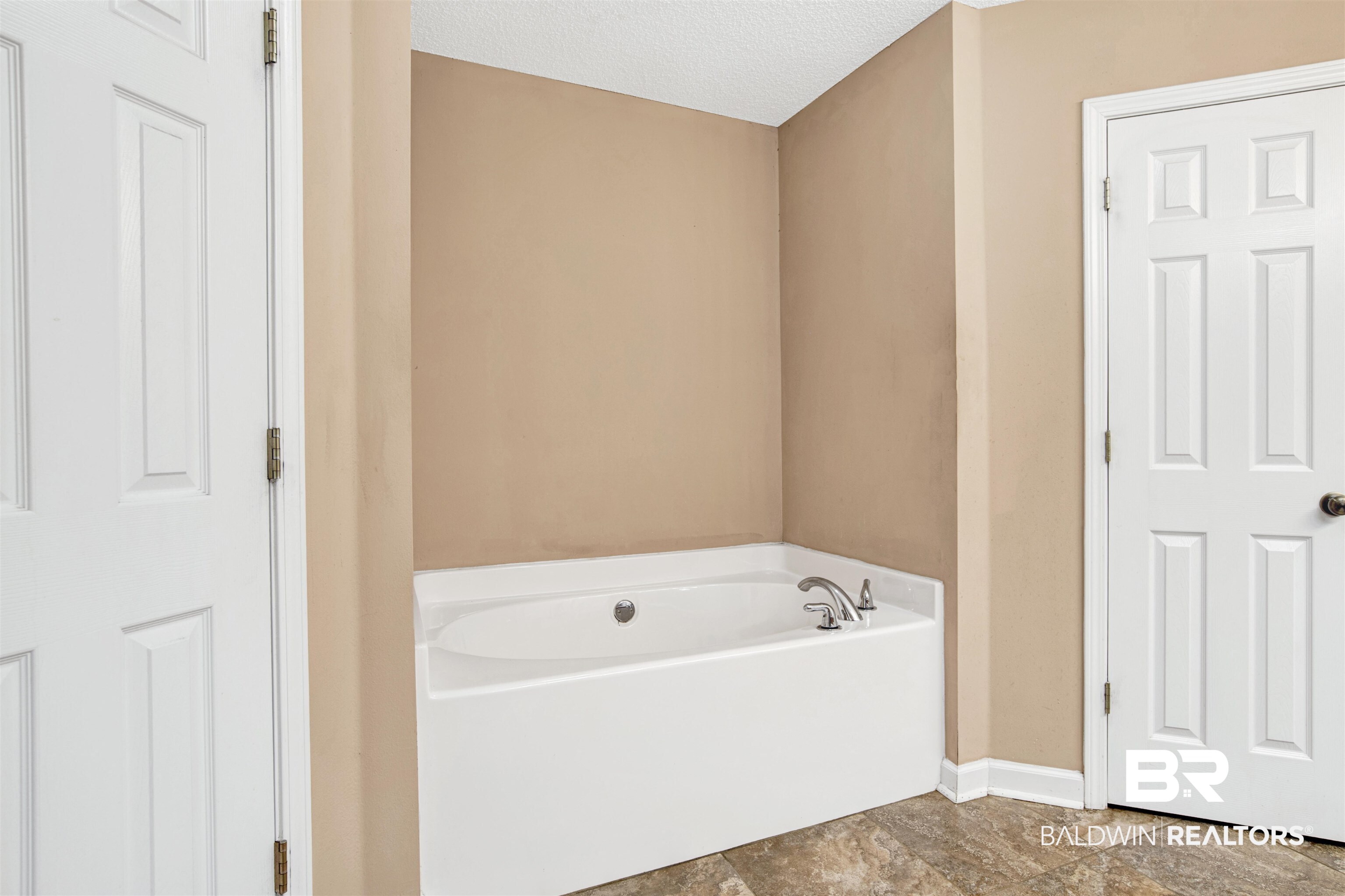 36434 Alexandria Trail Stapleton, AL 36578 - Photo 11 of 27 Full bath with a garden tub and a textured ceiling