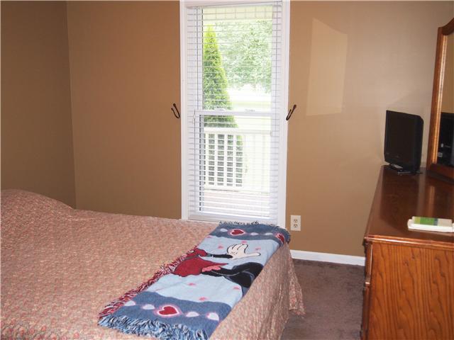 2848 Bolton Road Columbia, TN 38401 - Photo 12 of 20 a bedroom with a bed and flat screen tv
